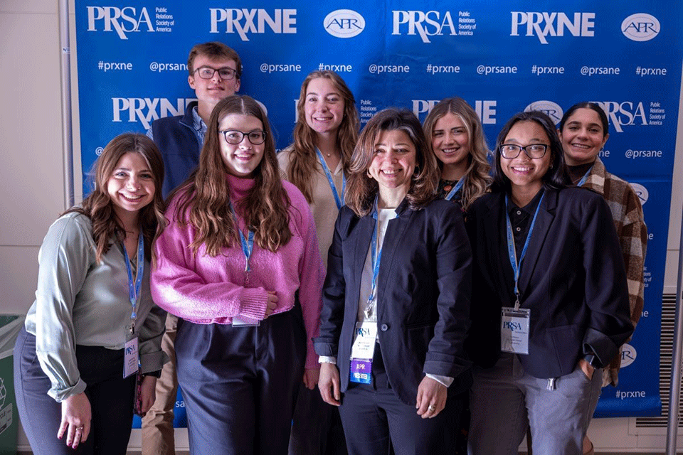 Professor Arien Rozelle with JAV目录 students at the 2023 PRxNE District Conference.
