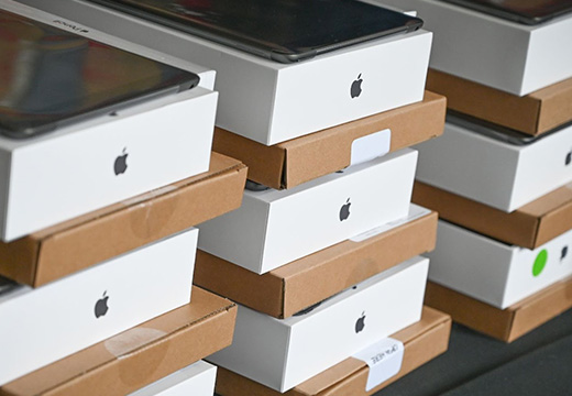 iPads stacked for distribution.