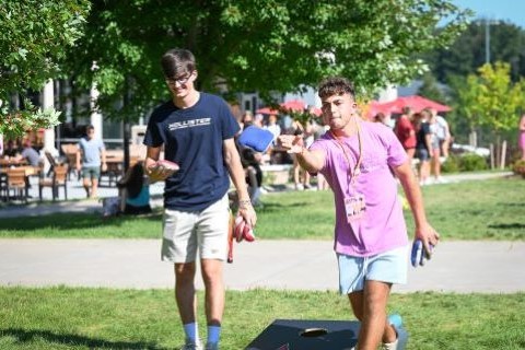 Students play lawn games during Welcome Weekend.